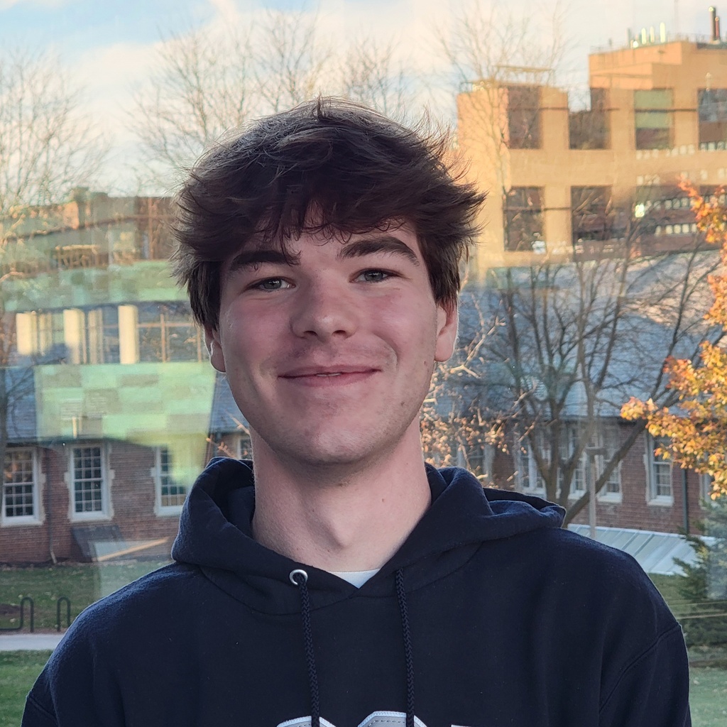 Photo of Ethan Rosendahl standing in front of buildings at the University of Iowa